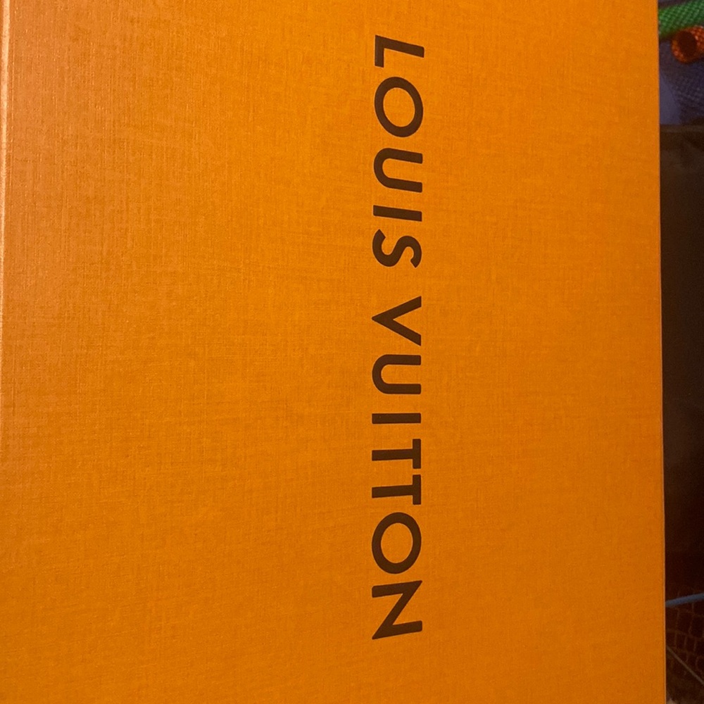 Authentic Louis Vuitton handbag with straps, comes with box